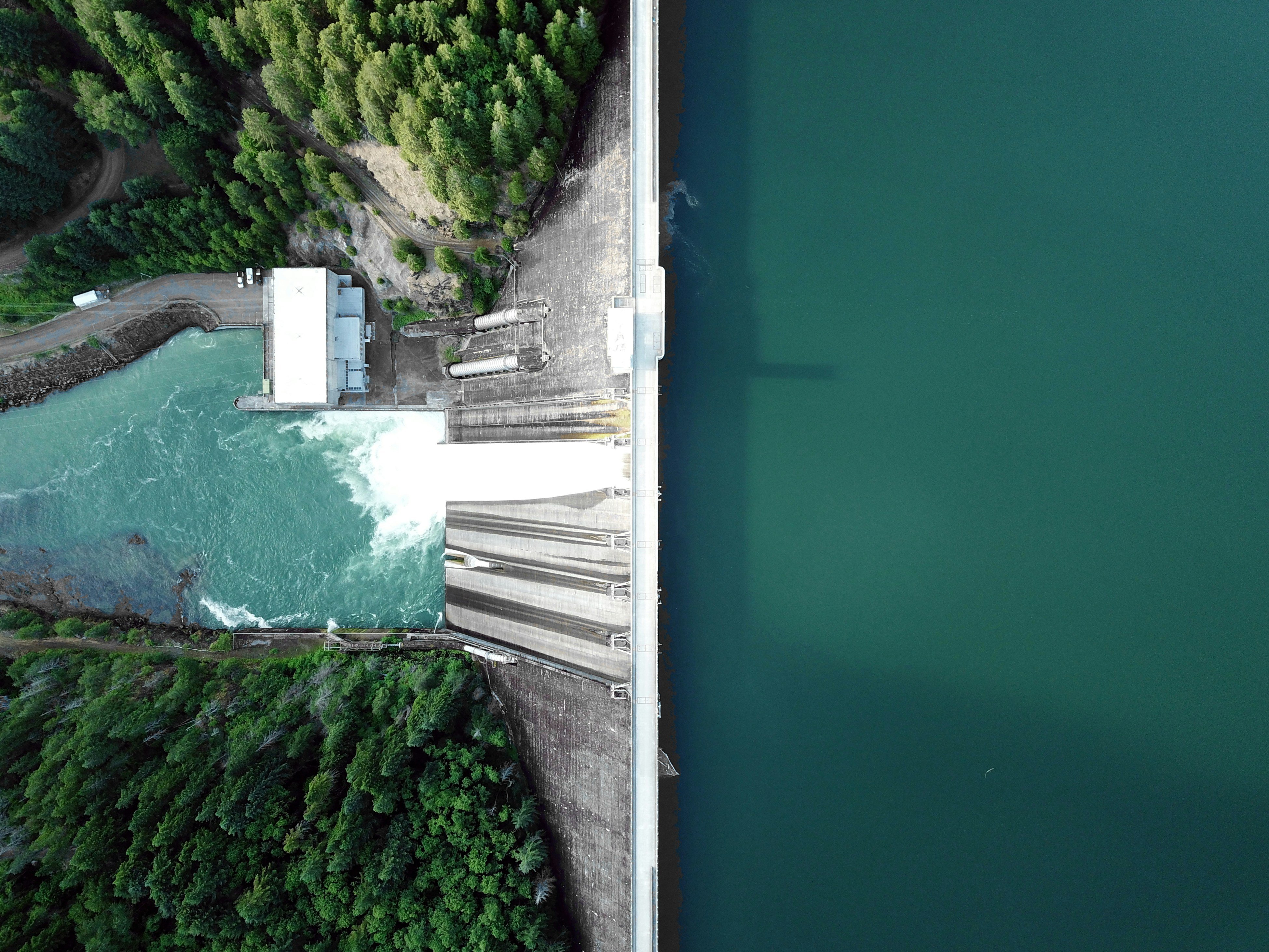 An aerial view of a dam and neighbouring reservoir