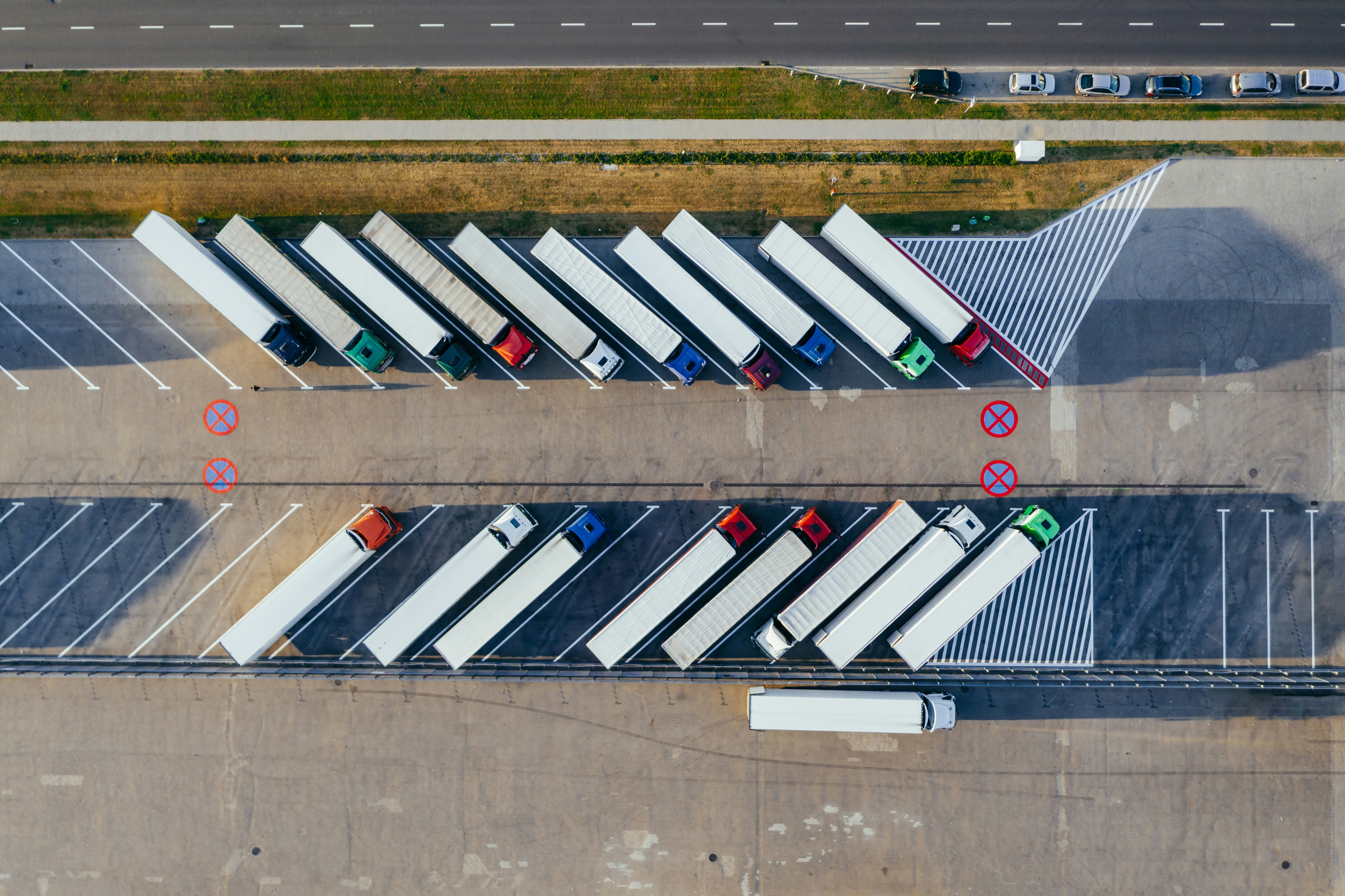 An aerial view of several parked HGVs